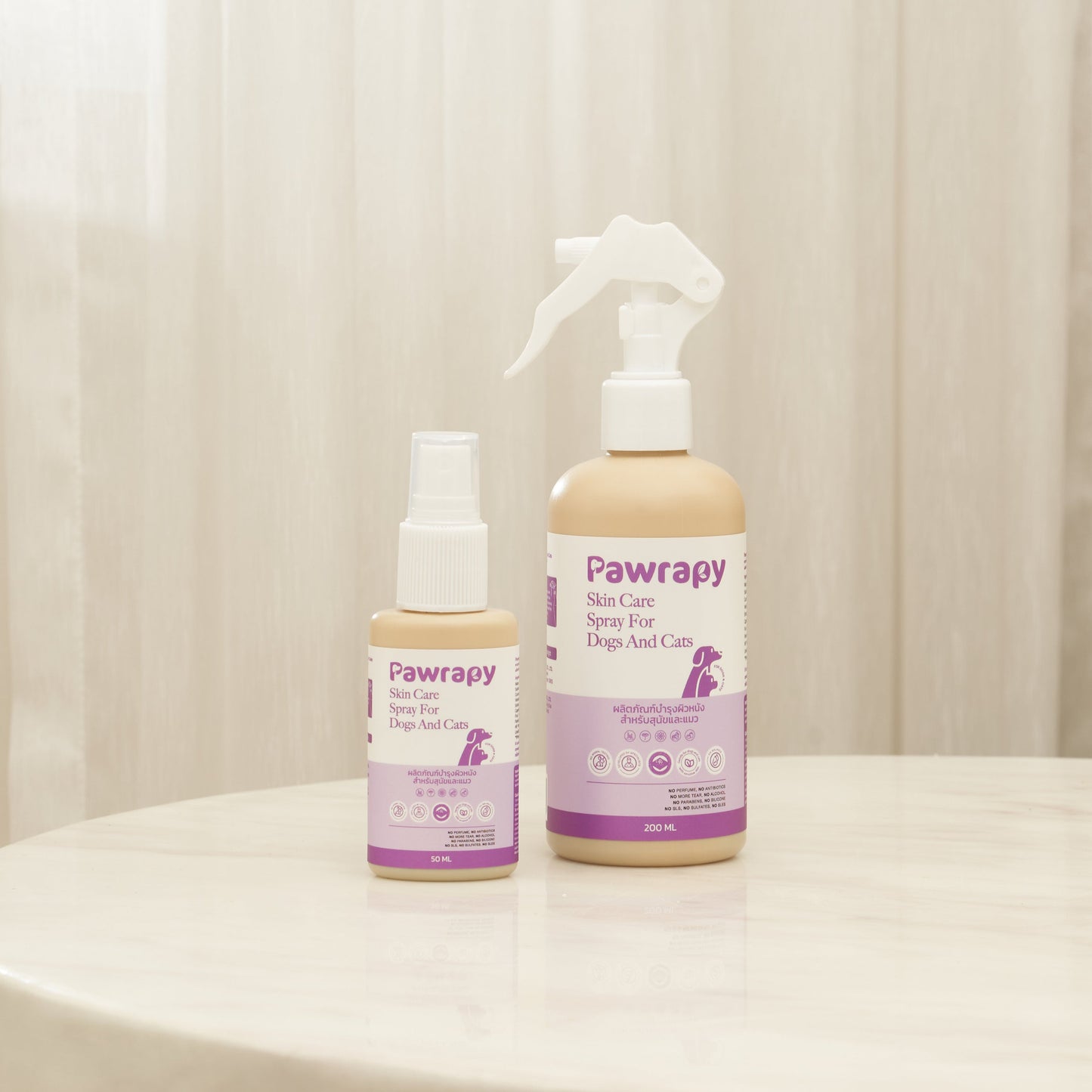 Two bottles of Pawrapy pet care products on a light surface with a neutral background